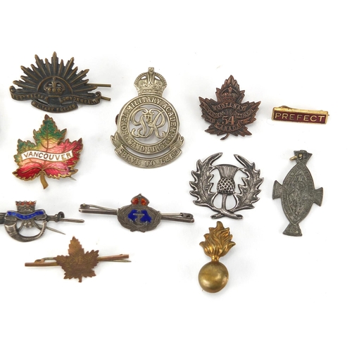 310 - British Military interest cap badges, brooches and soldiers service and pay book including 9ct gold ... 