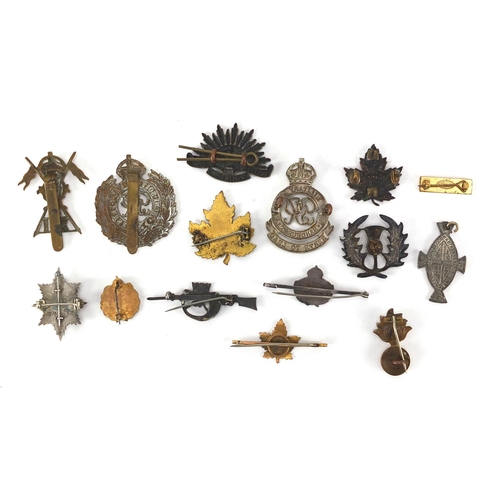 310 - British Military interest cap badges, brooches and soldiers service and pay book including 9ct gold ... 