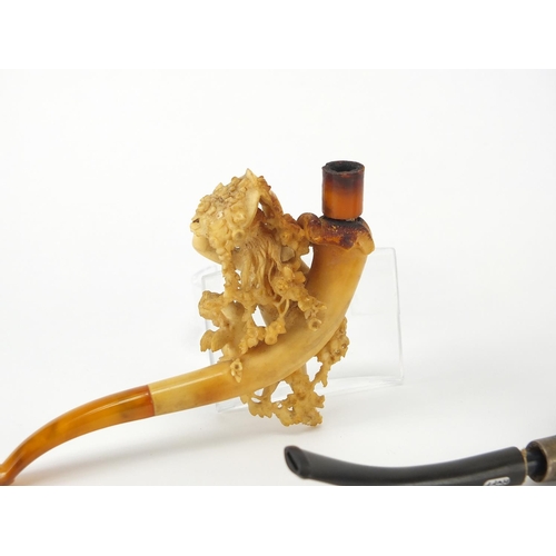 51 - Two Meerschaum pipes including one of a nude maiden and a putti, the largest 13.5cm in length