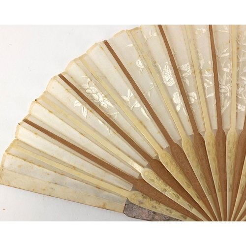 522 - Chinese silk fan with silver guards, ivory and sandalwood sticks carved with flowers, the silk fan e... 