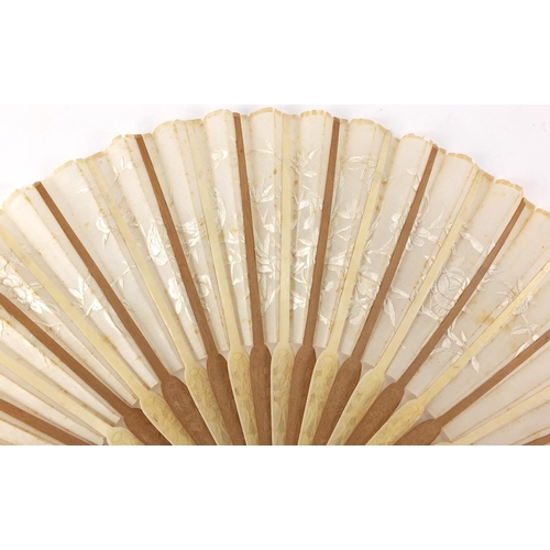 522 - Chinese silk fan with silver guards, ivory and sandalwood sticks carved with flowers, the silk fan e... 