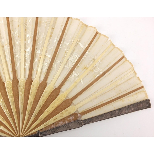 522 - Chinese silk fan with silver guards, ivory and sandalwood sticks carved with flowers, the silk fan e... 