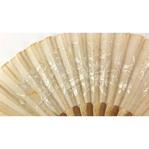 522 - Chinese silk fan with silver guards, ivory and sandalwood sticks carved with flowers, the silk fan e... 