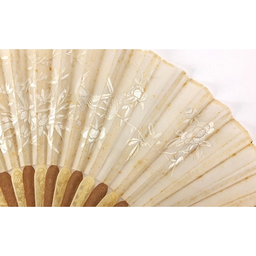 522 - Chinese silk fan with silver guards, ivory and sandalwood sticks carved with flowers, the silk fan e... 