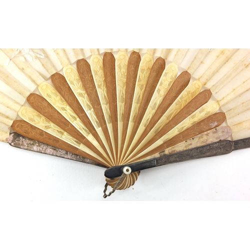 522 - Chinese silk fan with silver guards, ivory and sandalwood sticks carved with flowers, the silk fan e... 