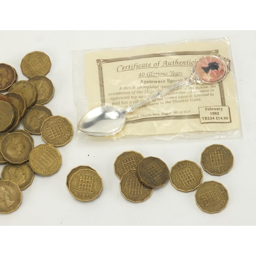 493 - Group of 1940's and later three penny bits and an agateware teaspoon