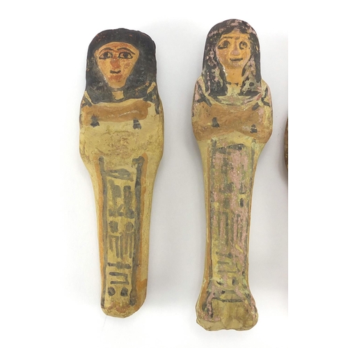 543 - Four 19/20th century Egyptian terracotta/stone ushabti, with remnants of painted decoration, the lar... 