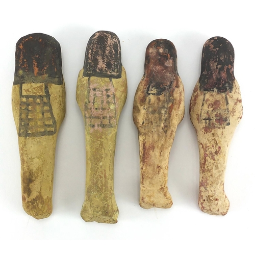 543 - Four 19/20th century Egyptian terracotta/stone ushabti, with remnants of painted decoration, the lar... 