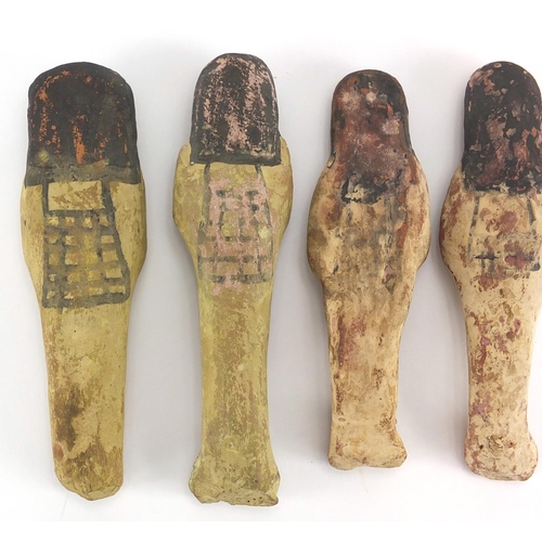 543 - Four 19/20th century Egyptian terracotta/stone ushabti, with remnants of painted decoration, the lar... 