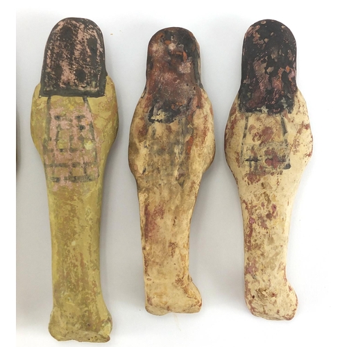 543 - Four 19/20th century Egyptian terracotta/stone ushabti, with remnants of painted decoration, the lar... 