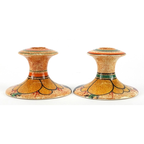 644 - Pair of Clarice Cliff Café au Lait candlesticks, both hand painted with an abstract pattern, retaile... 