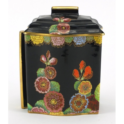 656 - Carlton Ware black hollyhock biscuit jar hand painted and gilded, factory marks to the base, 16cm hi... 