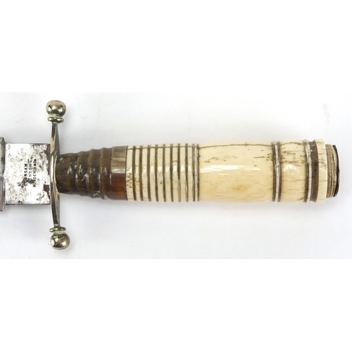 348 - Hunting dagger with horn and ivory handle and brass sheath, the steel blade engraved with foliate mo... 