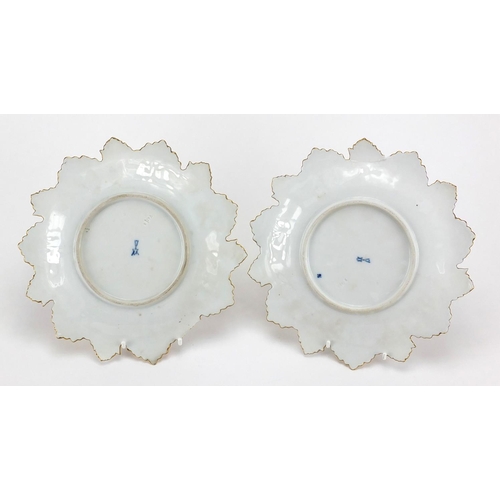 584 - Pair of Meissen porcelain flower head plates hand painted with gilt decoration, blue under glaze cro... 