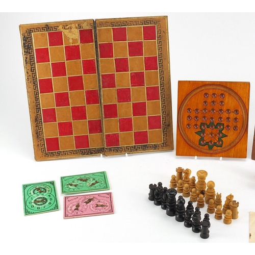 392 - Victorian mahogany games compendium, housing a solitaire board, cribbage board, marbles, chess set a... 