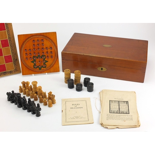 392 - Victorian mahogany games compendium, housing a solitaire board, cribbage board, marbles, chess set a... 