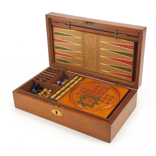 392 - Victorian mahogany games compendium, housing a solitaire board, cribbage board, marbles, chess set a... 