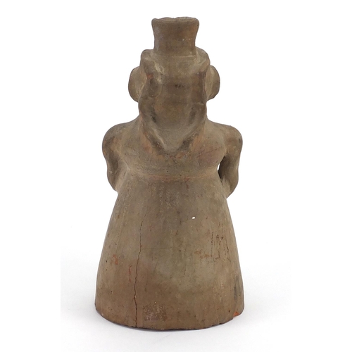 563 - Columbian pottery figure of a man, 25.5cm high