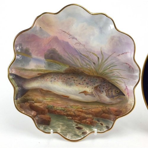 608 - Three Victorian hand painted cabinet plates comprising one with a salmon, Windsor Castle and a Count... 