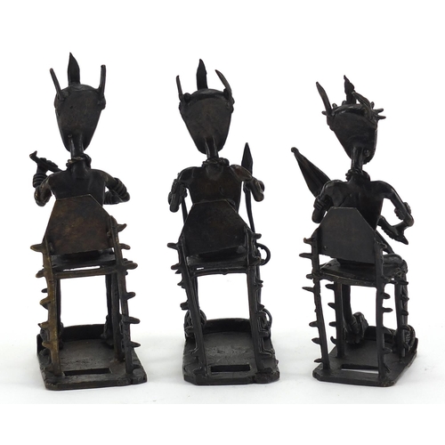 561 - Three African Ashanti bronzes, each of seated tribesmen, the largest 19cm high