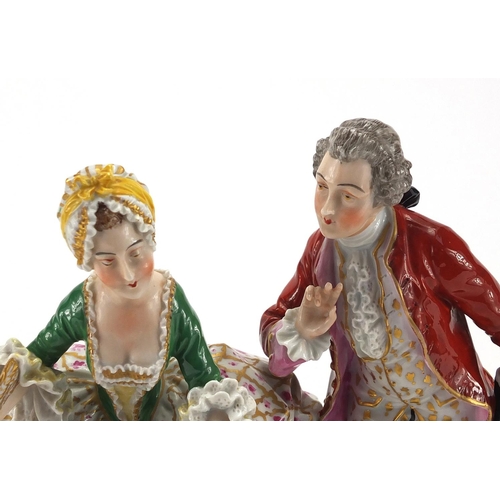 587 - Dresden hand painted porcelain figure group of a courting couple, factory marks to the base, 20cm hi... 