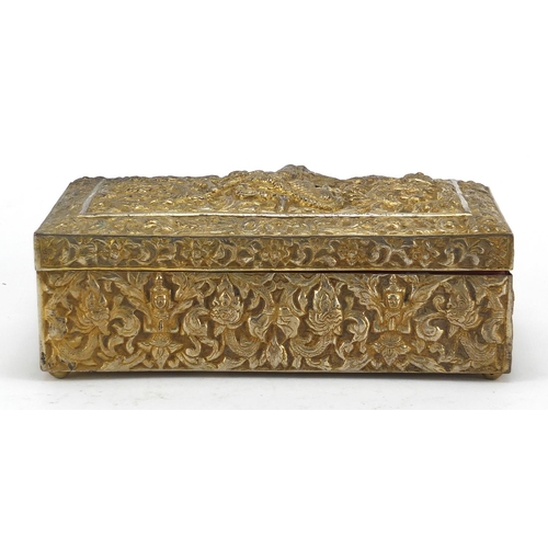 555 - Burmese/Thai silver box, profusely embossed with figures amongst foliage, character marks to the bas... 