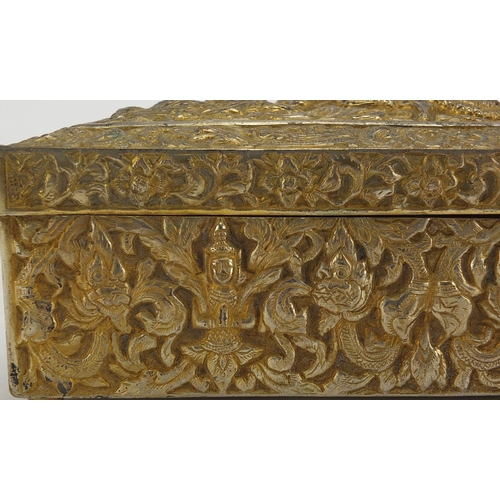 555 - Burmese/Thai silver box, profusely embossed with figures amongst foliage, character marks to the bas... 