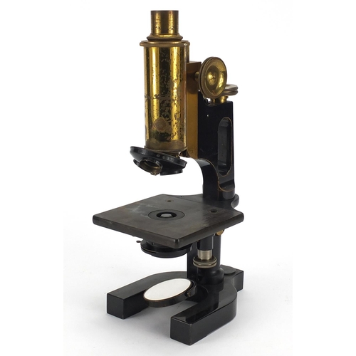 117 - Bausch & Lomb adjustable lacquered brass microscope with fitted carrying case, the case 36cm high