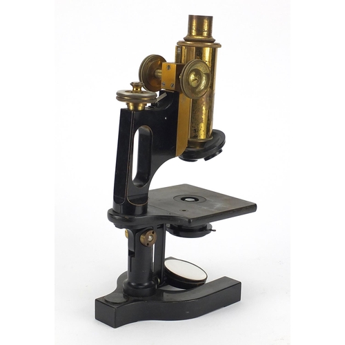 117 - Bausch & Lomb adjustable lacquered brass microscope with fitted carrying case, the case 36cm high