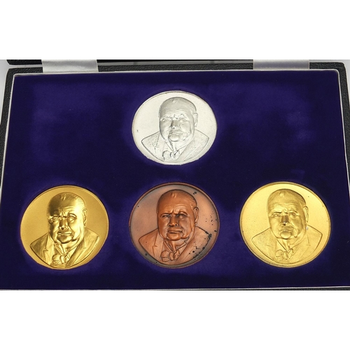 263 - Four Sir Winston Churchill commemorative medallions comprising one in 22ct gold, one silver gilt, on... 