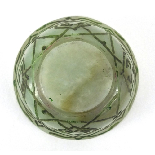 545 - Islamic green jade cup incised with stylised floral motifs, 6cm in diameter