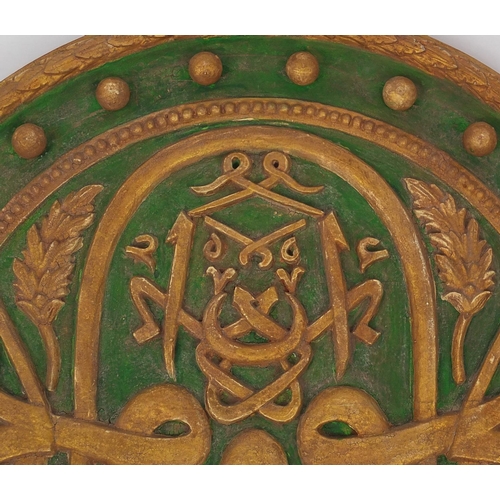 571 - Circular Turkish wooden calligraphy panel hand painted in green and gilt, 63cm in diameter