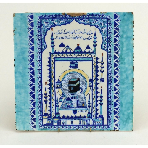 562 - Large Turkish ceramic tile, hand painted with a Mosque, script and foliate motifs, 30cm x 30cm