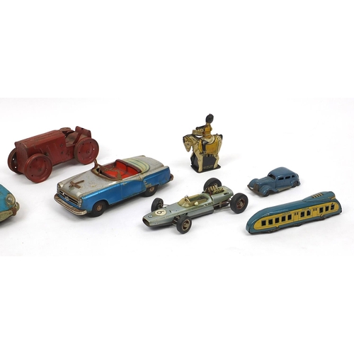 396 - Vintage and later toys including Tri-Ang tractor, Schuco 1072 racing vehicle, Japanese tin plate car... 