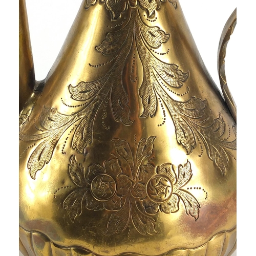 546 - Turkish gilt copper ewer and basin, all engraved with flowers, the ewer 40cm high