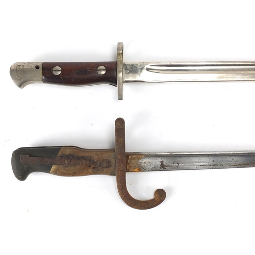 340 - Two Military interest bayonets, both with scabbards including a 19th century example, dated 1881 to ... 