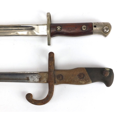 340 - Two Military interest bayonets, both with scabbards including a 19th century example, dated 1881 to ... 