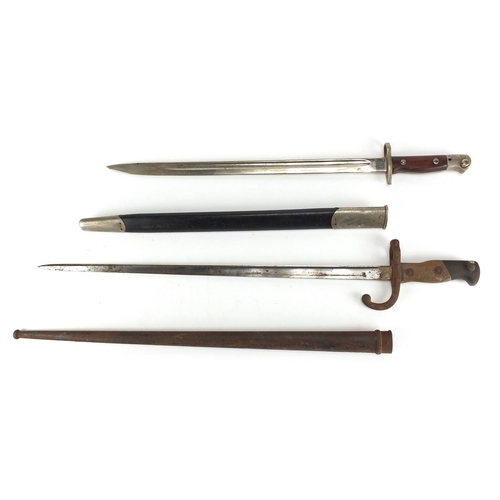 340 - Two Military interest bayonets, both with scabbards including a 19th century example, dated 1881 to ... 