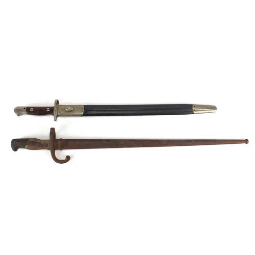 340 - Two Military interest bayonets, both with scabbards including a 19th century example, dated 1881 to ... 