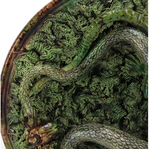 598 - Portuguese majolica palissy ware plate decorated with a snake and beatles, impressed marks to the re... 