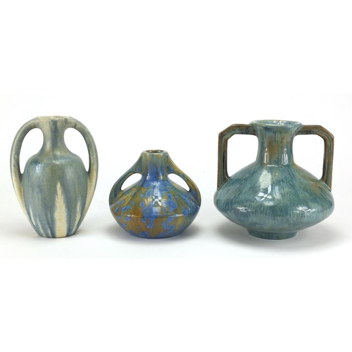 673 - Three French art pottery vases by Pierrefonds, all with twin handles, two with a crystalline glaze, ... 