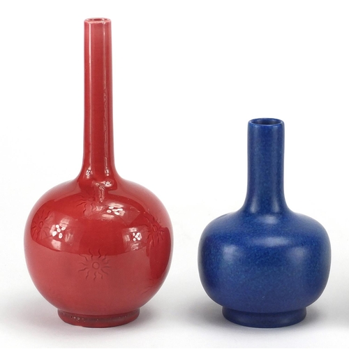 658 - Two art pottery bottle vases comprising a pink glazed Burmantufts and a blue glazed Pilkingtons exam... 