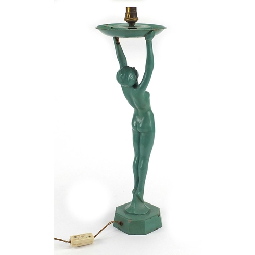 689 - Art Deco green painted figural lamp base, modelled as a nude female with her arms upwards stretched,... 