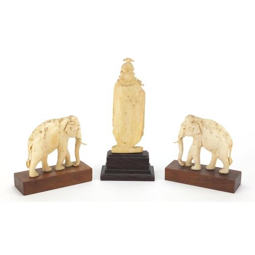 103 - Indian ivory comprising a pair of elephants and a goddess playing a flute, each raised on a hardwood... 