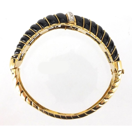 797 - Designer 18ct gold and black stone bangle set with diamonds, LWJ makers mark, 7cm in diameter, appro... 