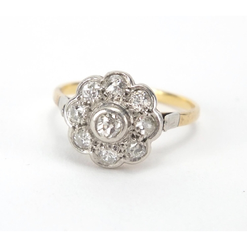 843 - Unmarked gold diamond flower head ring, size P, approximate weight 3.3g