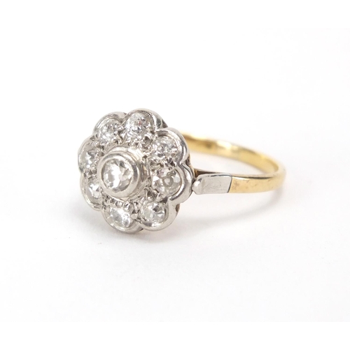 843 - Unmarked gold diamond flower head ring, size P, approximate weight 3.3g