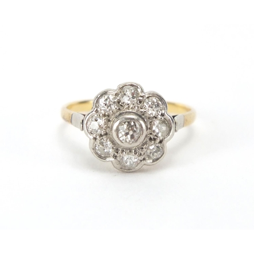 843 - Unmarked gold diamond flower head ring, size P, approximate weight 3.3g