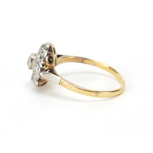 843 - Unmarked gold diamond flower head ring, size P, approximate weight 3.3g