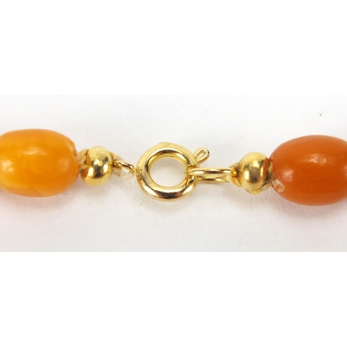 907 - Butterscotch amber coloured bead necklace, 76cm in length, approximate weight 27.6g